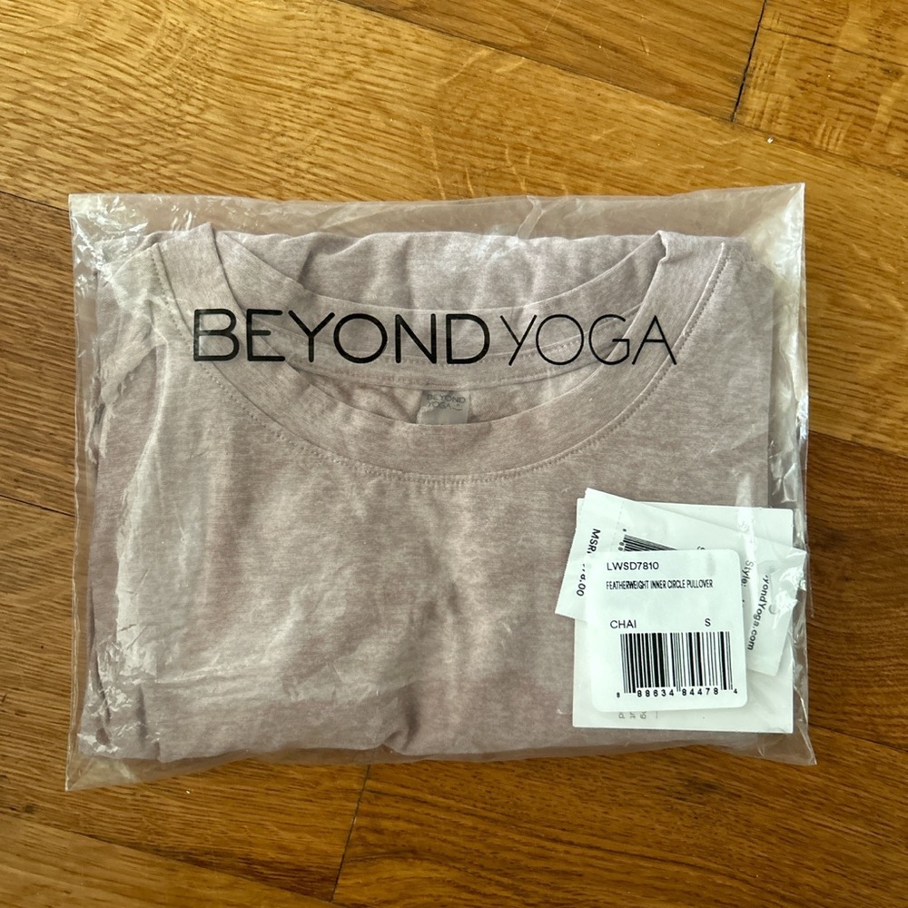 Brand new beyond yoga pullover with the cutest back details!